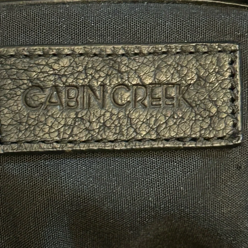 Vintage Cabin Creek Paisley Embossed genuine leather handbag grommet detailing